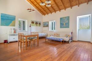a living room with a table and a couch at Zoe apartment in Marantochori