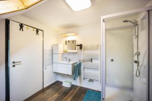 a bathroom with a shower and a sink at Salty Sol in Leutkirch im Allgäu +30 photos