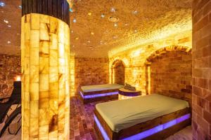 a room with two beds in a brick wall at Salty Sol in Leutkirch im Allgäu