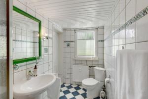 a white bathroom with a sink and a toilet at You R Welcome in Lauterbach +17 photos
