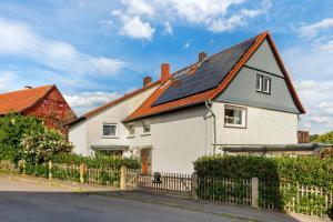 a house with solar panels on the roof at You R Welcome in Lauterbach