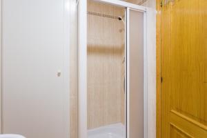 a shower with a glass door in a bathroom at Carmen in Oliva +24 photos