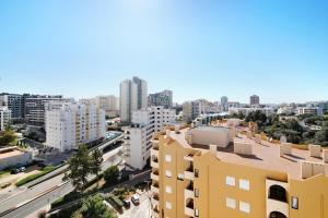 an aerial view of a city with tall buildings at Apartamento Freire in Portimão