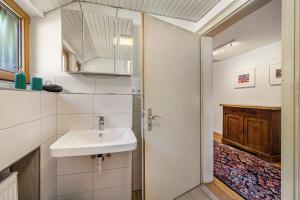 a bathroom with a sink and a mirror at Haus an der Lauchert in Veringenstadt +35 photos