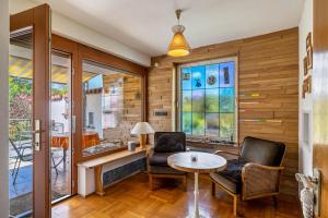 a living room with two chairs and a table at Haus an der Lauchert in Veringenstadt