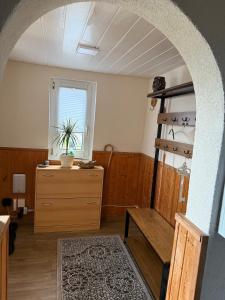 a room with a dresser and a window at Ferienhaus Harz Idylle 3 in Güntersberge