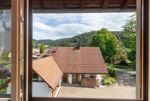 a view from a window of a house with a roof at Gästehaus Hanni in Todtmoos