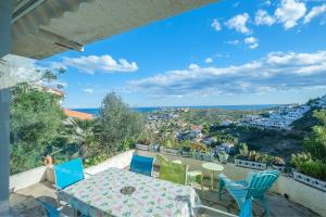 a view from the balcony of a house with a table and chairs at Maison Mer Peniscola in Peniscola