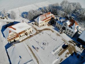 an aerial view of a building covered in snow at Ferienwohnung Gut Börtewitz in Leisnig