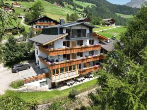 an aerial view of a house in a mountain at App Hubertus - Wasserfallspitz in Sand in Taufers