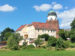 a large building with a tower on top of it at bund Ferienwohnung in Lenzen