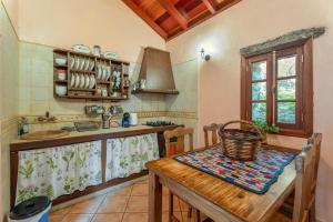 a kitchen with a table with a basket on it at Gran Drago in Valverde