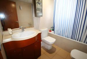 a bathroom with a sink and a toilet and a shower at Villa María Magdalena in Cambrils +21 photos