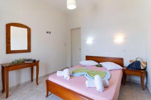 a bedroom with a bed with towels on it at Nikiana Club - Studio 4 in Nikiana