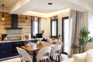 a kitchen and dining room with a table and chairs at Aje Villas 1959 in Ioannina
