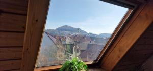 a window with a view of a city at M B Homes Albstadt in Albstadt