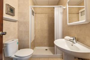 a bathroom with a toilet and a sink and a shower at Estudio Mirada 304 in Es Pujols +13 photos