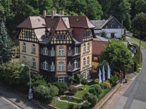 a large house with a garden in front of it at Apartment in Villa Rochlitz in Rochlitz