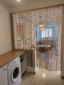 a laundry room with a washing machine in a room at Casa Guayo in Tías