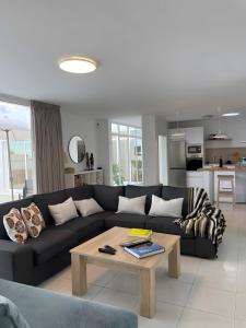 a living room with a couch and a coffee table at Casa Guayo in Tías