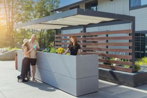 a man and a woman standing at a counter at Ruby River Hotel in Spokane