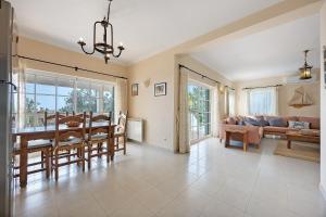 a living room with a table and a couch at Monte Lemos Villa 35 in Luz