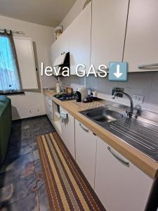 a kitchen with a sink and a counter top at Casa Moki in Uliveto Terme