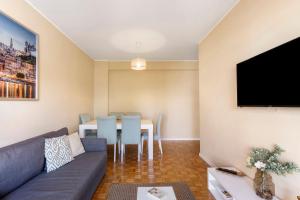 a living room with a couch and a table at Destiny Oporto in Maia