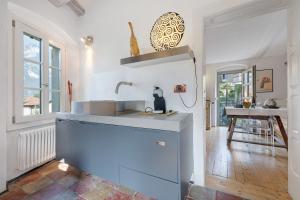 a kitchen with a sink and a counter top at La Guardiola I By Immobilux in Riva del Garda