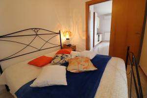 a bedroom with a bed with pillows on it at Casa Vacanze Marta in Otranto