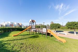 a playground with a slide in a park at Apartamento Luz De Baria in Vera