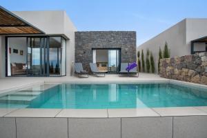 a swimming pool in the middle of a house at Yucas Villa 13 in San Bartolomé