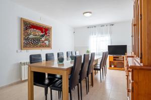 a dining room with a table and chairs at Masía Costa Daurada in Tarragona