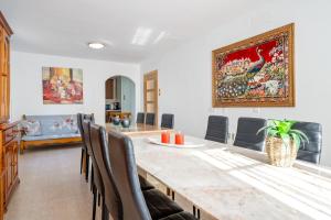 a dining room with a table and chairs at Masía Costa Daurada in Tarragona