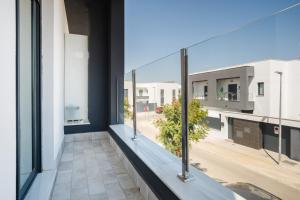 a view from a balcony of a building with windows at Casa flor del Rocio in La Rinconada