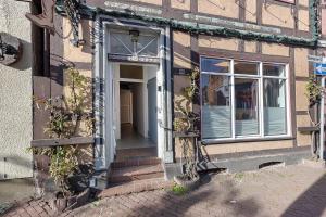an entrance to a building with a door and stairs at City Apartment in Uelzen