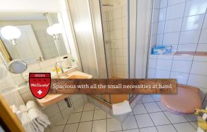 A bathroom at Hotel Walliserhof - The Dom Collection