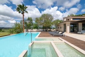 a swimming pool in the backyard of a house at Dalt Son Morro in Santa Margalida