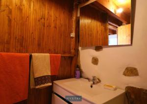 a bathroom with a sink and a mirror at Casa Alto Das Fragas in Canedo de Basto +4 photos