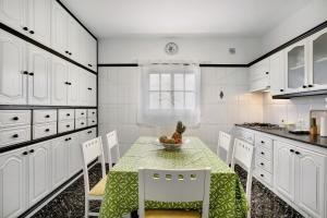 a kitchen with a table with a bowl of fruit on it at Los Morales in Arico +24 photos