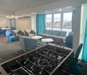 a living room with a stove and a couch at Abez Accs in Portsmouth