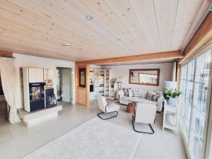 a living room with a couch and a fireplace at Villa Wolfsgrund und Apt Wolfshöhle in Schluchsee