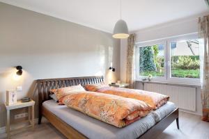 a bed in a bedroom with a window at Apartment Dreiländer Blick in Wintersweiler