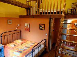 a bedroom with a bunk bed and a staircase at Domaine De Chante-Oiseau - 28 pers in Theil-Rabier +18 photos