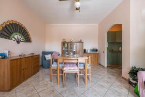 a kitchen with a table and chairs in a room at Tara house in Pula