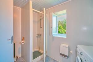 a bathroom with a shower and a window at Quiétude in Meyrals +22 photos