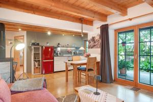 a kitchen and living room with a red refrigerator at Ferienwohnung Besamia in Todtnau