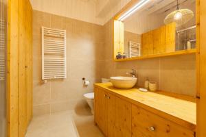 a bathroom with a sink and a toilet at Sant Rafel House in Arenys de Mar +10 photos