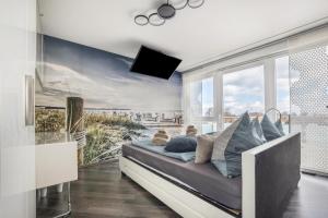 a bedroom with a bed with a large window at Studio in Steinhude