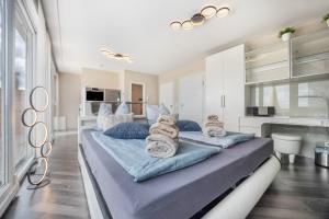 a bedroom with two beds with towels on them at Studio in Steinhude